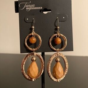 Tanya Creations golden and orange beaded earrings.